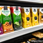 Home 21 다과와 편의점 디저트 - A vibrant convenience store snack display featuring a variety of innovative packaged snacks with exo...